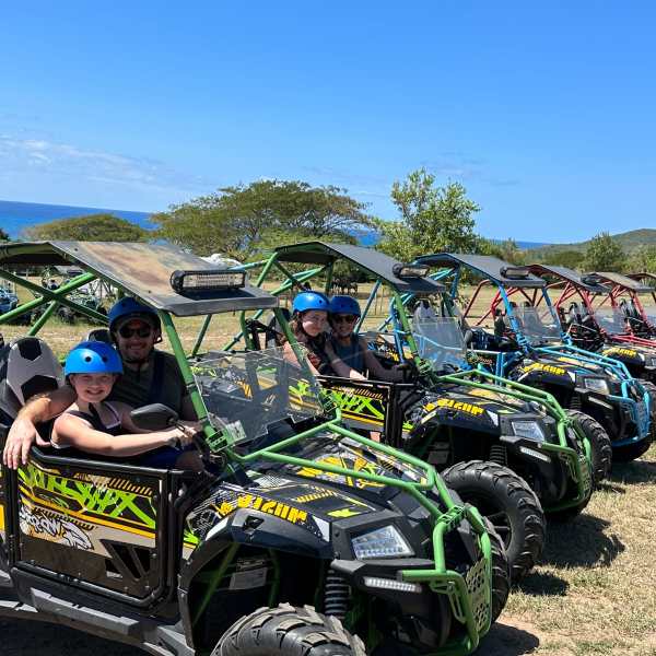 a group of people sitting on a motorcycle