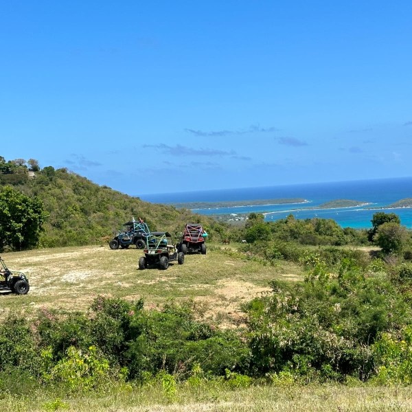 a motorcycle is parked on the side of a hill