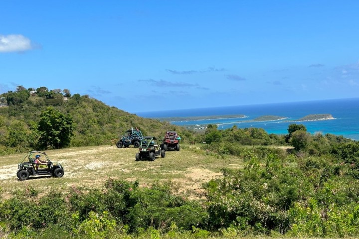 a motorcycle is parked on the side of a hill