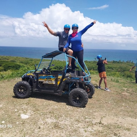 a man flying through the air while riding a bike down a dirt road