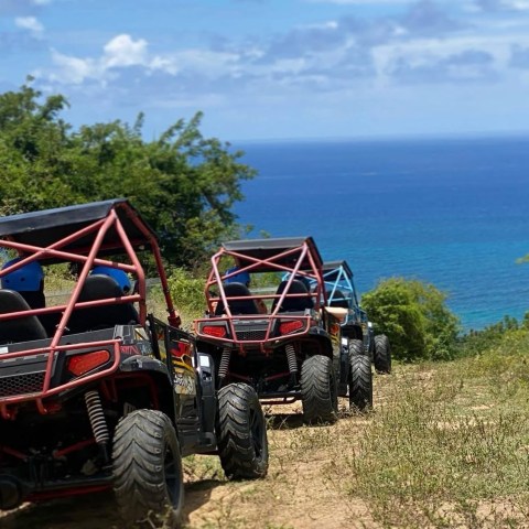a truck driving down a dirt road