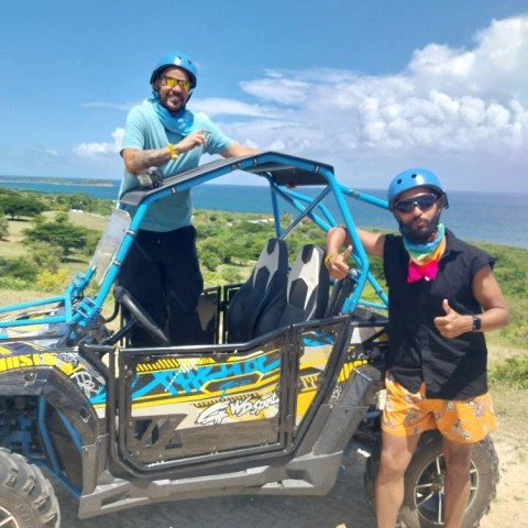 a group of people riding on the back of a truck